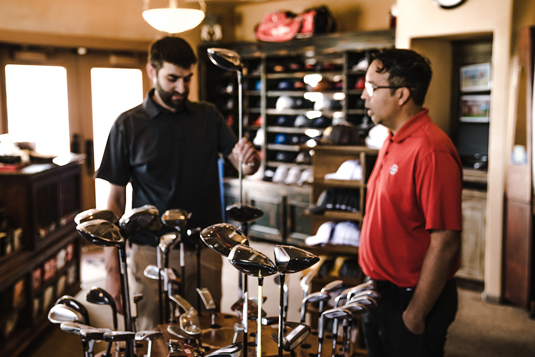 Men shopping for golf clubs